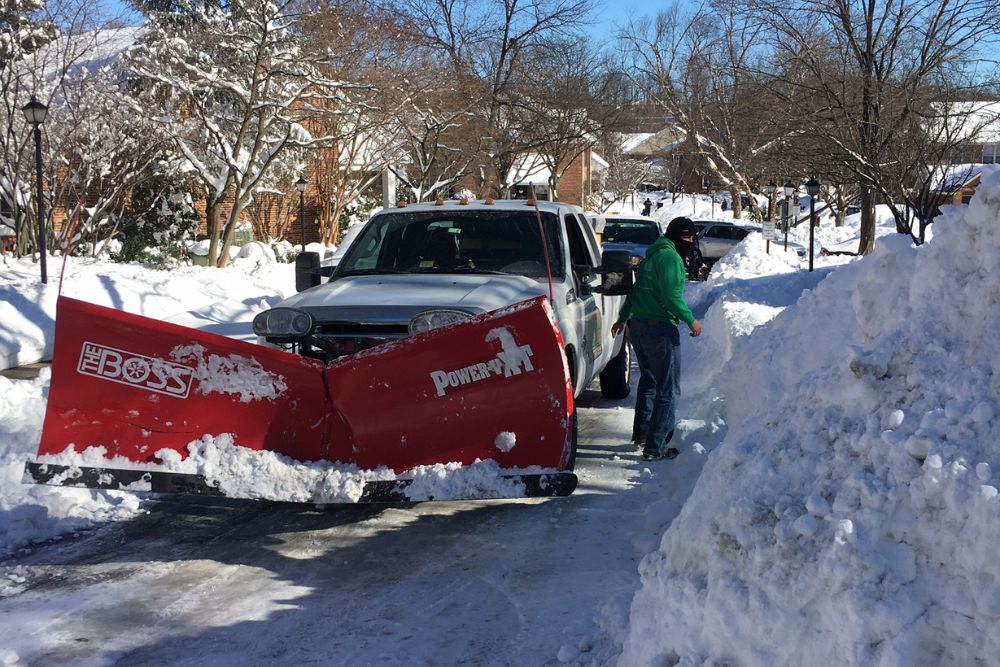 The Absolute Tree snow plow clearing out a driveway in Fairfax Station, VA.